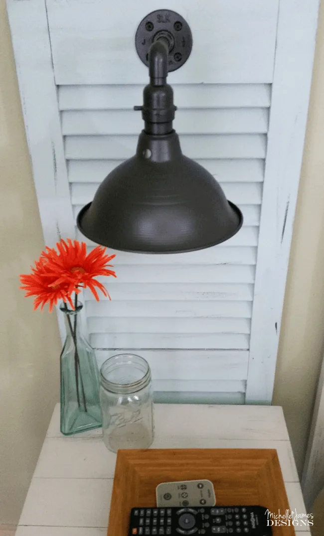 DIY Shutter Headboard - www.michellejdesigns.com - See how I created a headboard and bedside table sconces by using garage sale shutters!