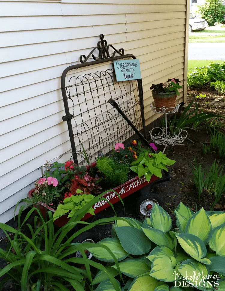 Wooden Garden Gate Sign - www.michellejdesigns.com - I created this wooden sign using scrap wood, my Silhouette machine and some paint! It adds a bit of "me" to my outdoor space.