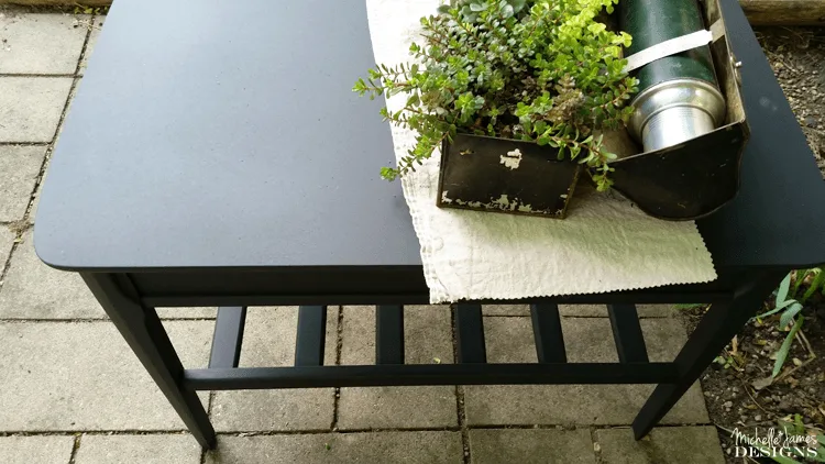 Sleek Black Table Makeover - www.michellejdesigns.com - I used Old Fashioned Milk Paint to transform this table into a sleek table for my son's apartment!