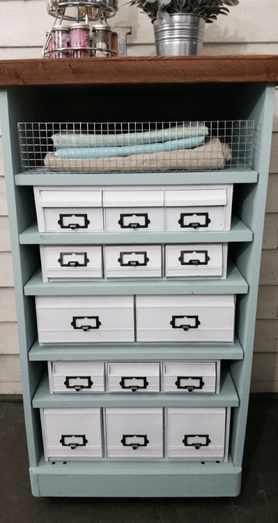 Craft Organizer - www.michellejdesigns.com - I found a bunch of the old 80's cassette, cd and vhs holders and gave them a cohesive look to create this awesome craft organizer!