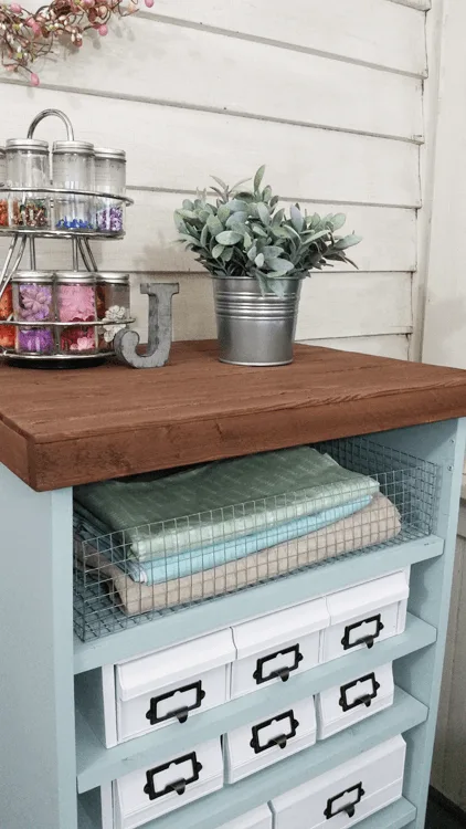 Craft Organizer - www.michellejdesigns.com - I found a bunch of the old 80's cassette, cd and vhs holders and gave them a cohesive look to create this awesome craft organizer!
