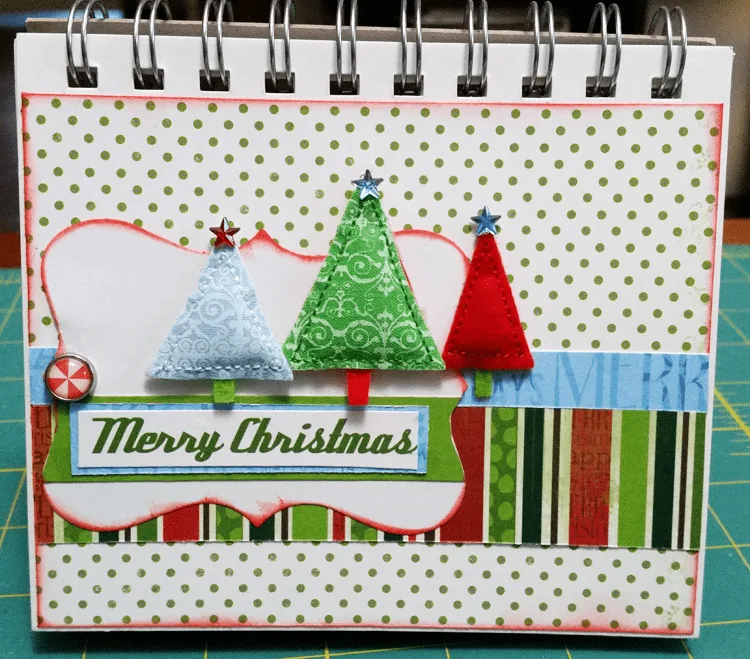 Holiday-Planner - www.michellejdesigns.com - I used a collection of Christmas scrapbook papers and a 4x5 notebook to create a functional holiday planner to help keep everything organized this season!