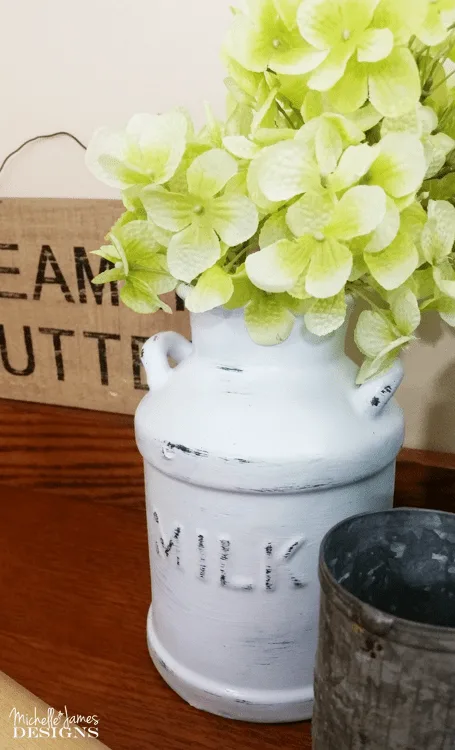 Thrift Store Ceramic Milk Cans - www.michellejdesigns.com - I turned these ceramic milk cans into decor for my kitchen. They are now the perfect farmhouse look that is so popular now!