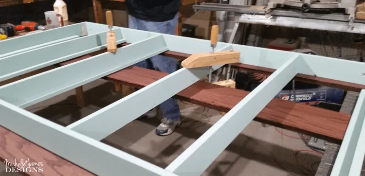 This DIY dining table was made with an oak top and a painted base and was the perfect custom fit for my son and daughter-in-law's dining room.