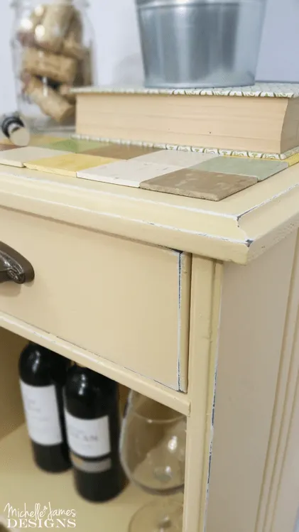 This little rickety accent table was transformed and re-styled using pieces of free tile samples. 