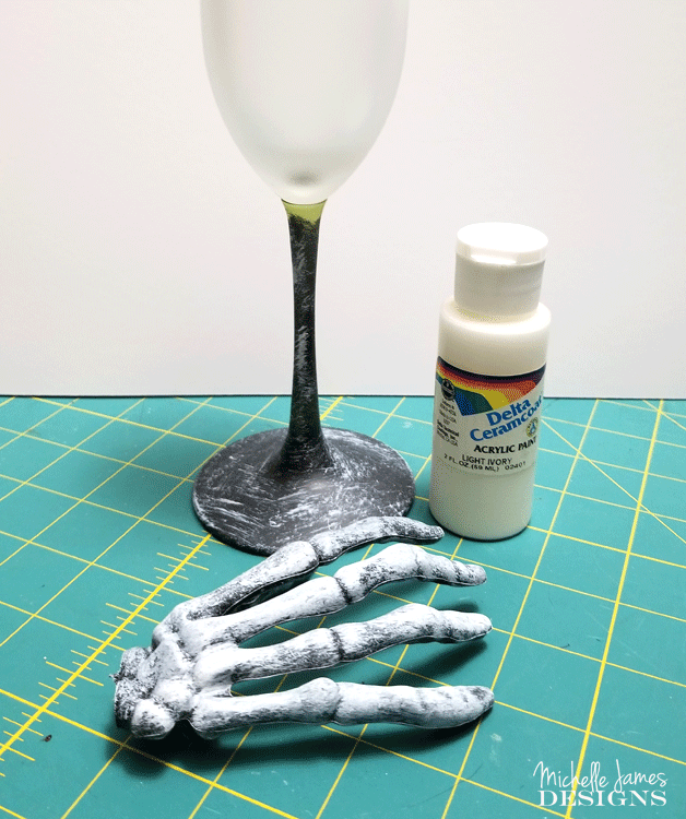 With a few supplies from the Dollar Store you are will on your way to creating some creepy skeleton wine glasses for your Halloween decor - www.michellejdesigns.com