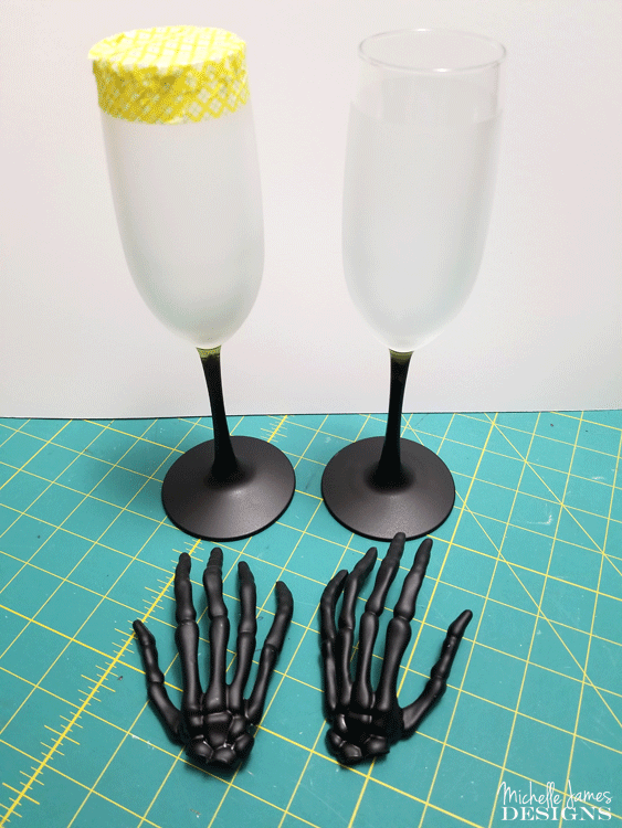 With a few supplies from the Dollar Store you are will on your way to creating some creepy skeleton wine glasses for your Halloween decor - www.michellejdesigns.com