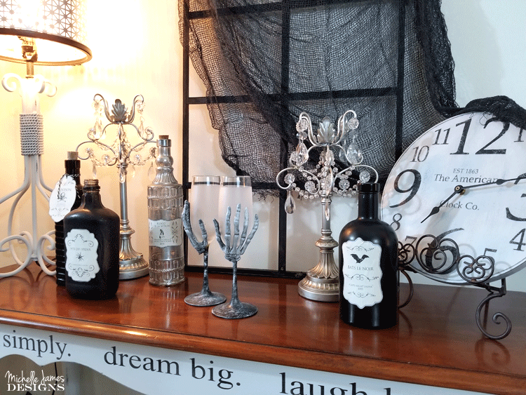 With a few supplies from the Dollar Store you are will on your way to creating some creepy skeleton wine glasses for your Halloween decor - www.michellejdesigns.com