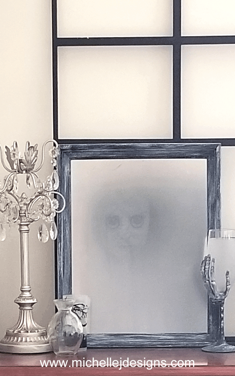 Create a haunted Halloween mirror this season. This DIY Halloween mirror will creep out your friends and family! - www.michellejdesigns.com