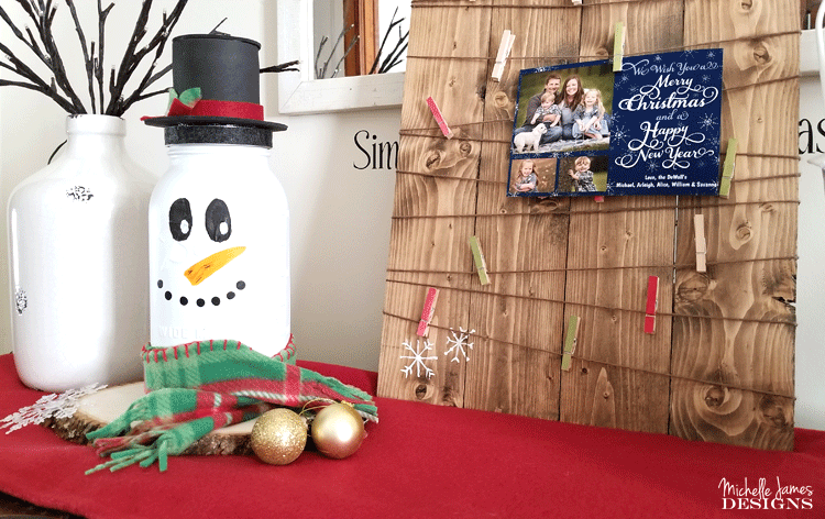 Take a look at my fun snowman mason jar craft. He is tall, festive and the perfect addition to my holiday decor. - www.michellejdesigns.com