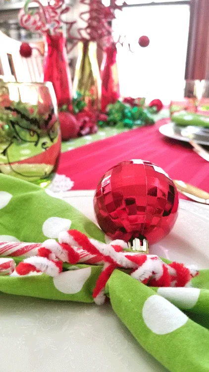 This year I decided to include a theme and create a fun table. I love my Grinch inspired table setting and I think my family will too! - www.michellejdesigns.com