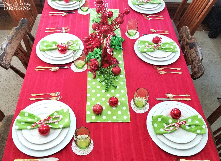 This year I decided to include a theme and create a fun table. I love my Grinch inspired table setting and I think my family will too! - www.michellejdesigns.com