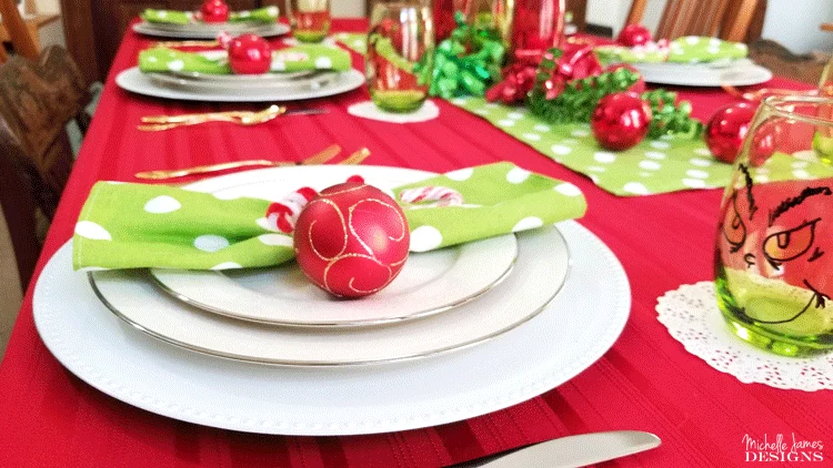 This year I decided to include a theme and create a fun table. I love my Grinch inspired table setting and I think my family will too! - www.michellejdesigns.com