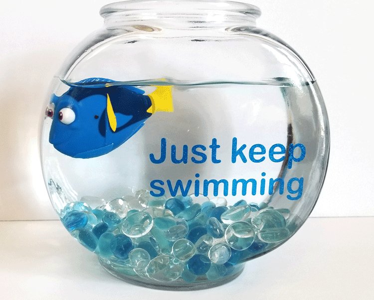 This inspiring Dory fishbowl keeps us going at work. We 'just keep swimming" everyday and Dory keeps us going! #dory #findingnemo #justkeepswimming - www.michellejdesigns.com