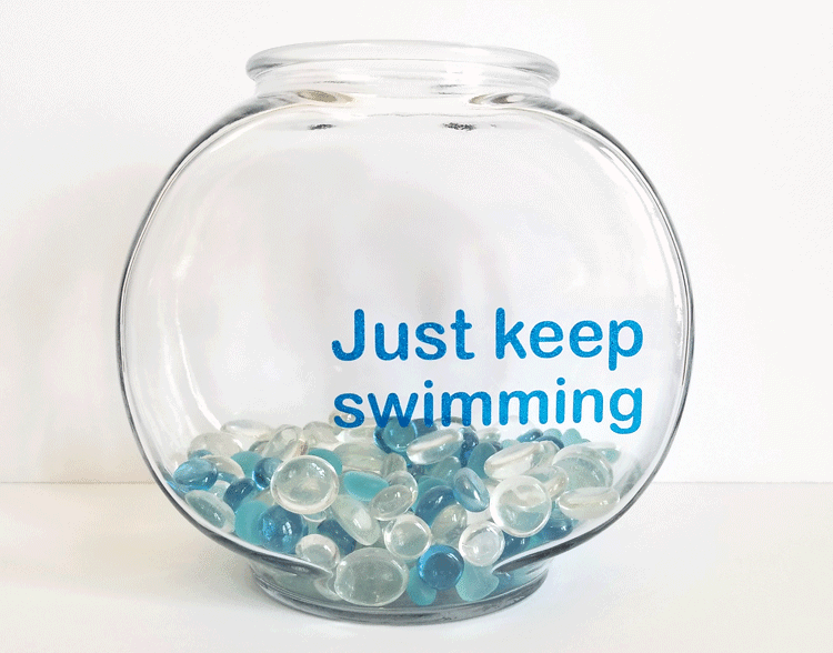 This inspiring Dory fishbowl keeps us going at work. We 'just keep swimming" everyday and Dory keeps us going! #dory #findingnemo #justkeepswimming - www.michellejdesigns.com
