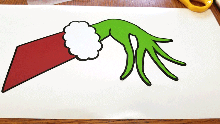 This DIY Grinch Inspired Stocking Wall Hanger is super cute and is the perfect touch if you don't have a mantel! www.michellejdesigns.com - #michellejdesigns #stockinghanger #grinchstockinghanger