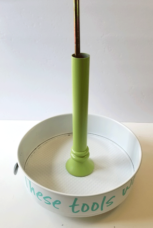 Adding the green metal tube part to add height to the tiered craft organizer