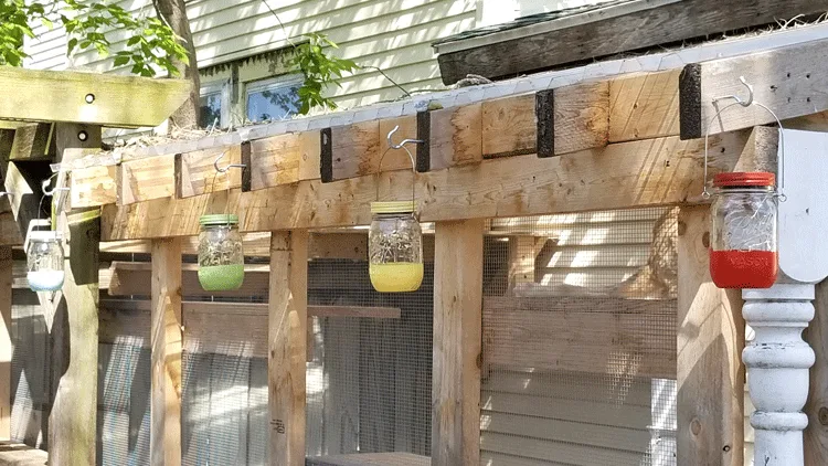 Finished mason jar lights hanging outside.