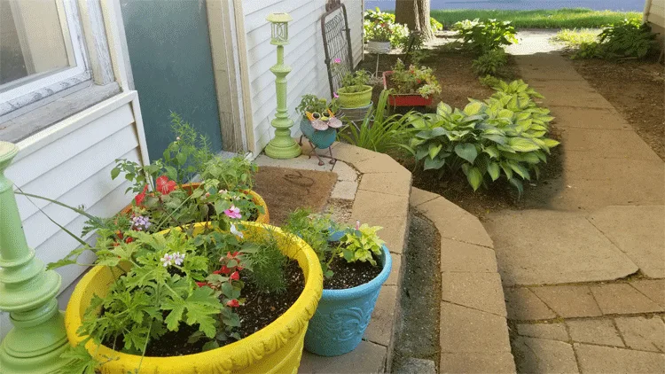 Three large foam flower pots at the backdoor with the radio flyer wagon filled with plants in the background.