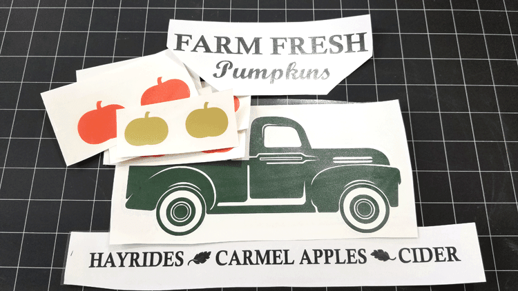 The fall vintage truck and pumpkins all cut out and ready to hang on the wall in the fall.