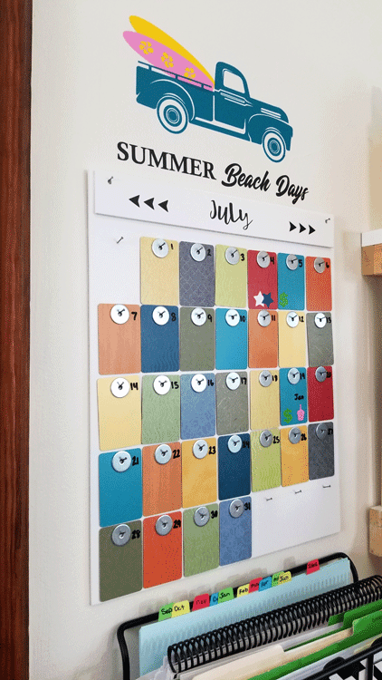 Angled side view of the finished, colorful formica sample wall calendar with the summer seasonal vintage truck design added to the wall above it.