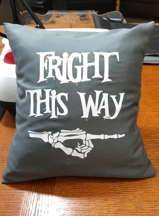 Close up of finished gray and white Fright This Way pillow