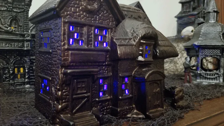 Close up of lighted Halloween village pieces on display