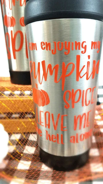 Close up of cheap travel mug with pumpkin spice saying