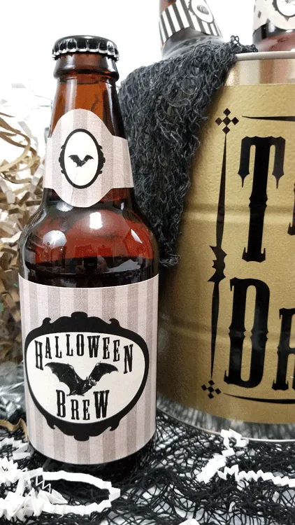 Finished Trick or Drink Halloween bucket and four beer bottles with Halloween printable labels.
