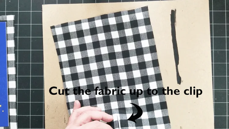 Cut the fabric from the edge up to the clip.