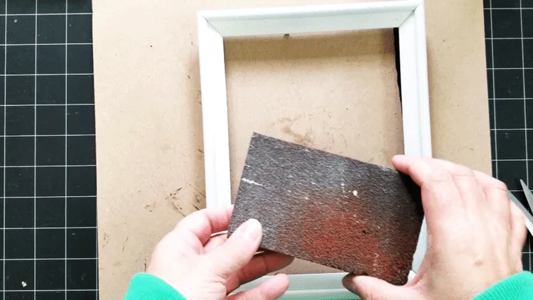 The sanding block used to distress the white frames.