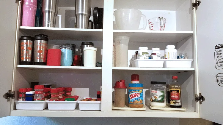 Full cupboard with the spices and meds organized.