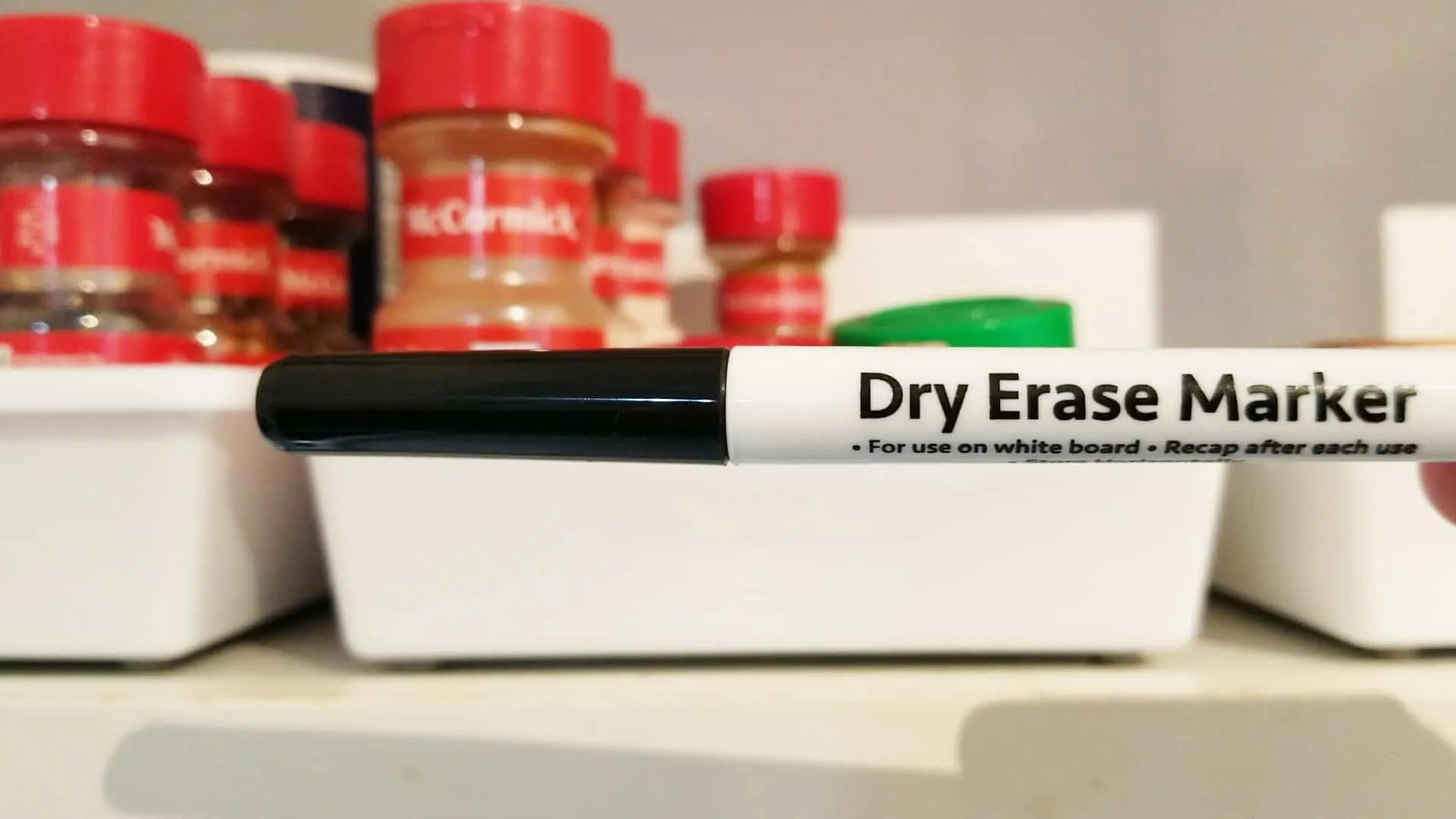 Showing that a Dry Erase pen may be used on this container.