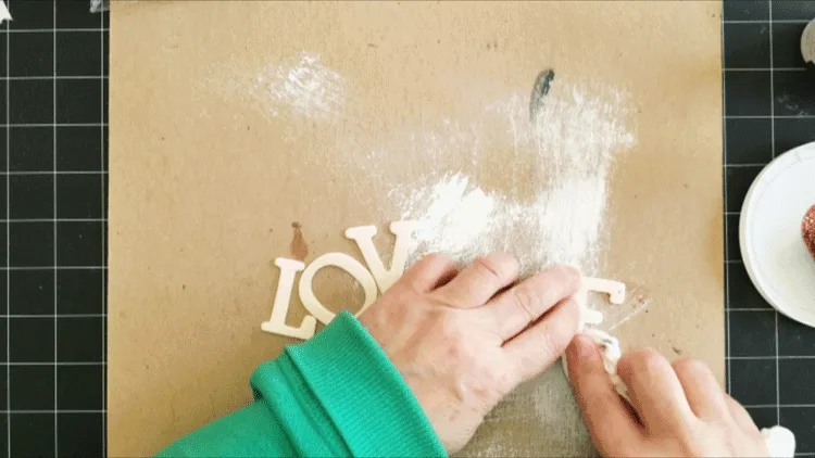 Using the wood letters from the Dollar Tree to spell out LOVE.