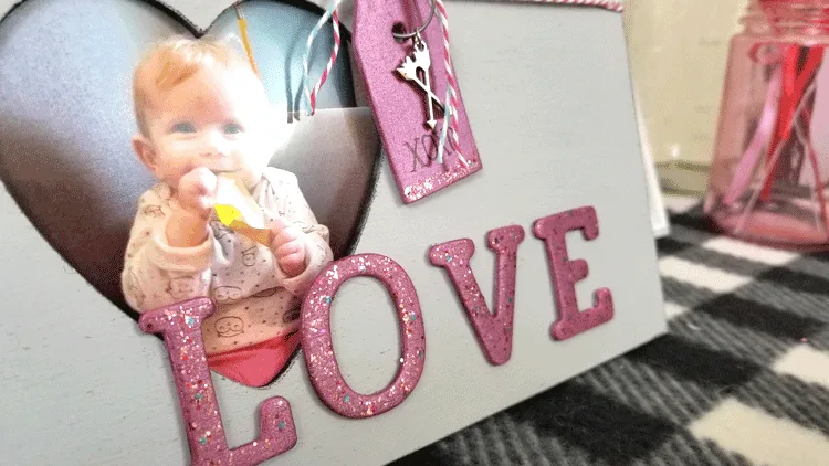 Finished Dollar Store Picture Frame all decorated with glitter letters and a fun tag.