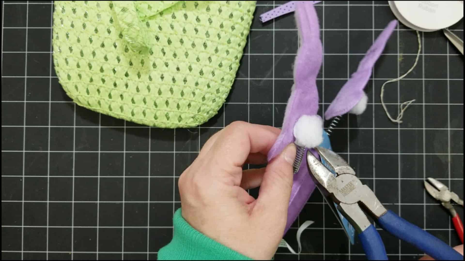 Adding hot glue to the front of the bunny.
