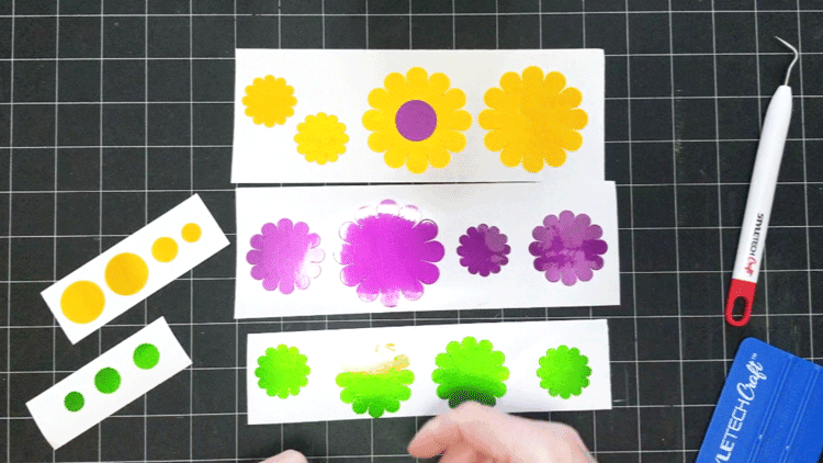 Flowers made with vinyl to add to a garden gift basket.
