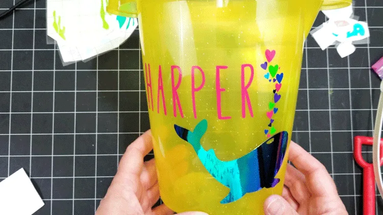 The finished sand bucket with Harper's name, the whale and the colorful hearts.