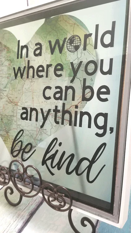 A close up view of the finished piece of diy kindness art displayed on an easel