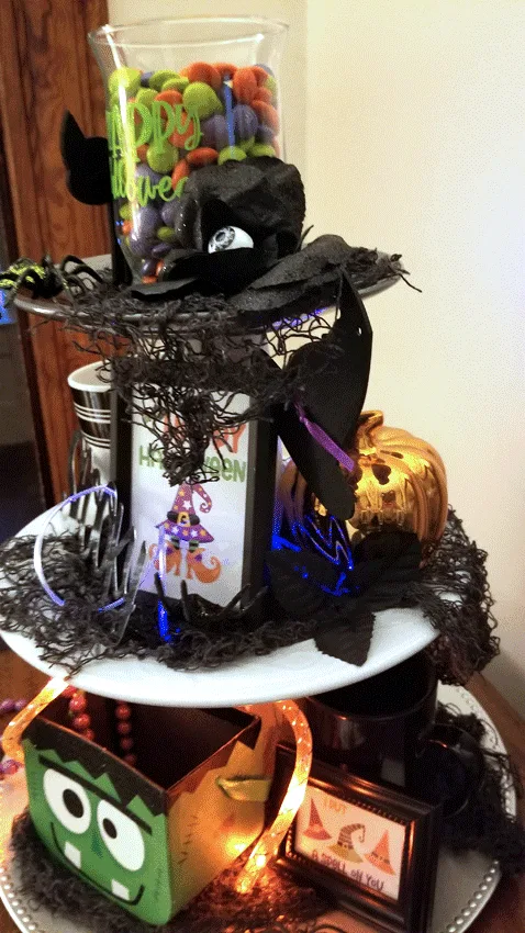 The finished tiered tray decked out with whimsical Halloween decor.