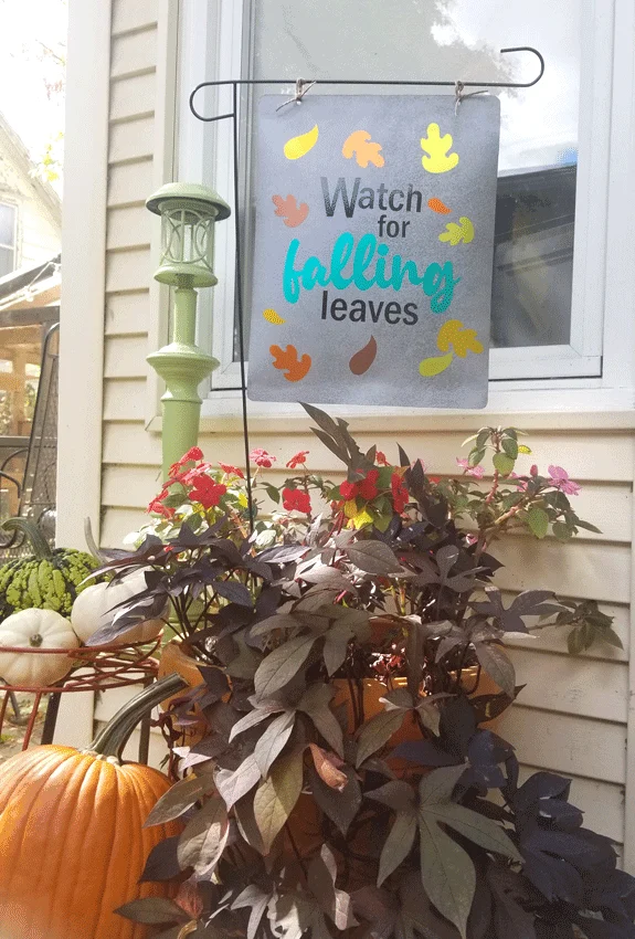 Finished garden flag on my back porch with pumpkins and fall flowers