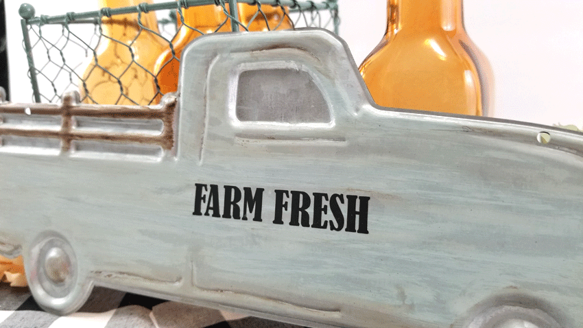 Close up view of the finished white washed metal truck.