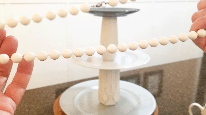 Adding beads to a tiered tray is a must.  Mine are white and not wood but they will do.