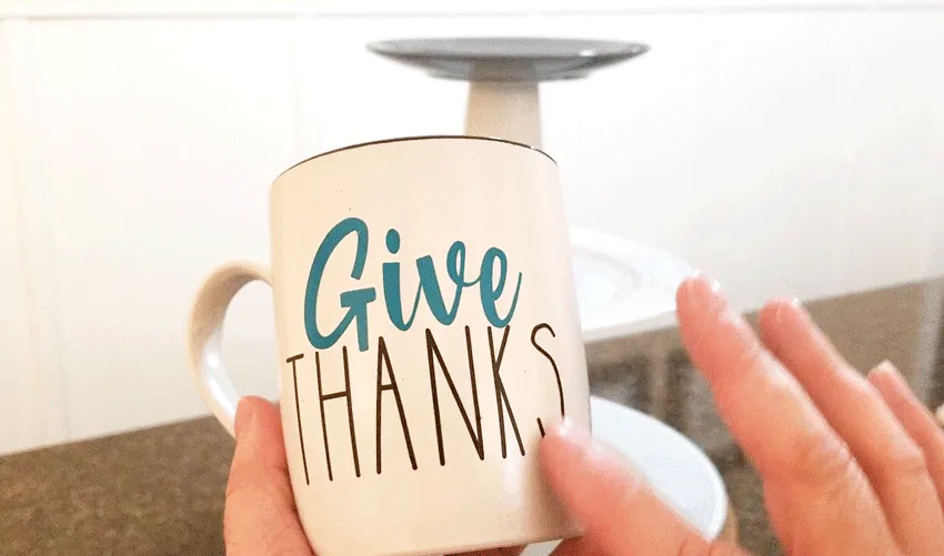 Dollar Tree mug with my "Give Thanks" SVG cut file cut from vinyl and applied to the mug.