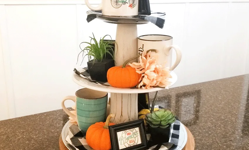 The back of the tiered tray with pumpkins and printables