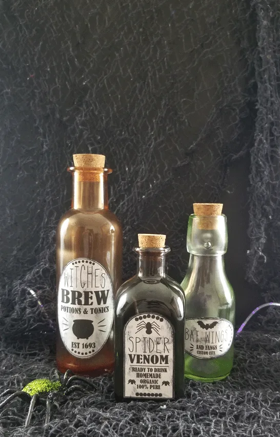 Potion labels and tinted glass bottles.  The finished authentic, spooky look