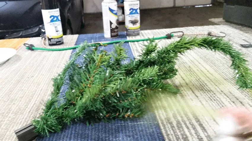 Adding Grinch green spray paint to the tree.