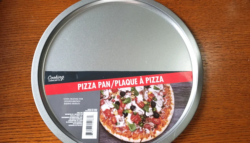A dollar tree pizza pan is the base for this metal tray