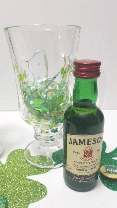Adding the Jameson Irish whiskey and green Easter grass to the mug as a gift.