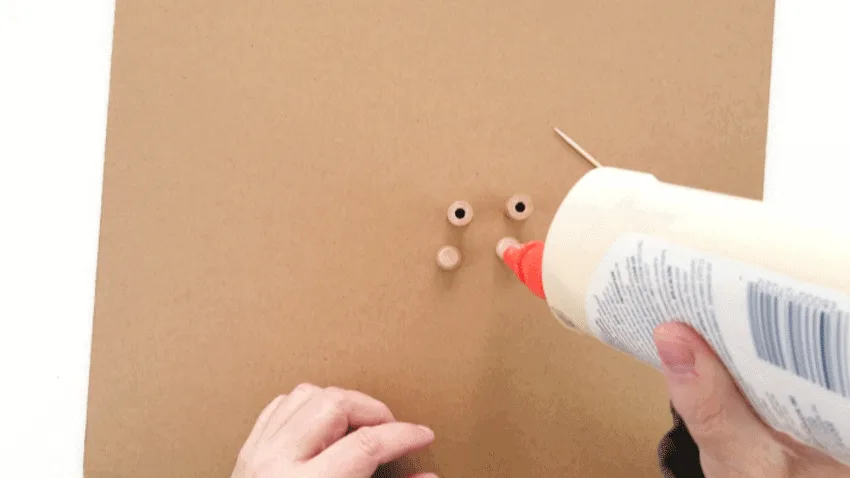 Adding wood glue to the bottom of the furniture button